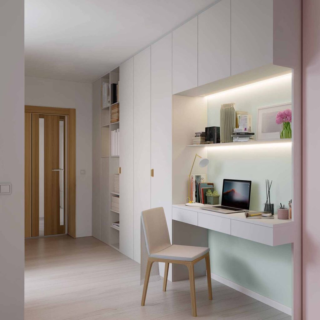 Integrierter Schreibtisch in weißem Einbauschrank mit Regalen, Laptop und Stuhl in kleiner Wohnung