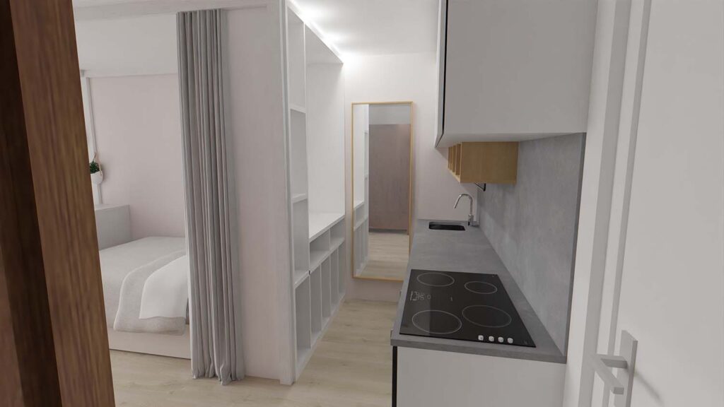 Küchenzeile im Studio Apartment mit Stauraum, Kochfeld und Übergang zur Schlafzone